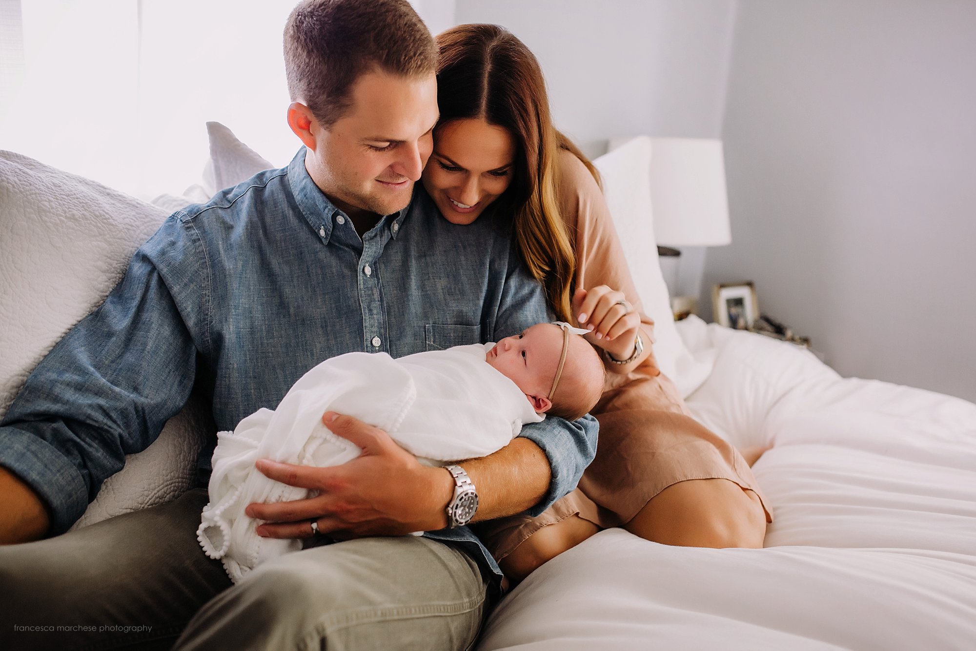Francesca Marchese Photography first time new parents with their newborn baby girl smiling