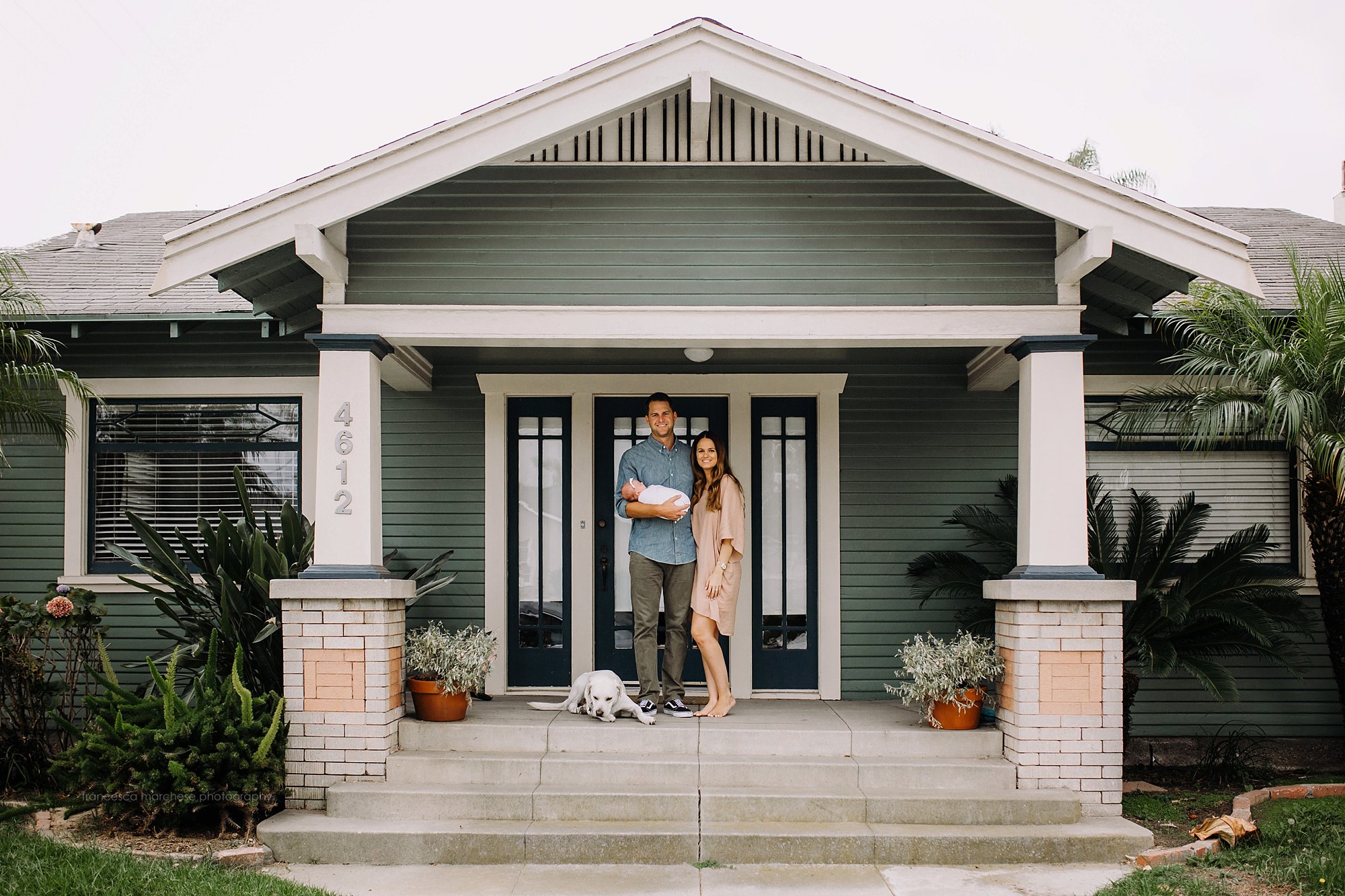 Francesca Marchese Photography first time new parents with their newborn baby on their porch with dog
